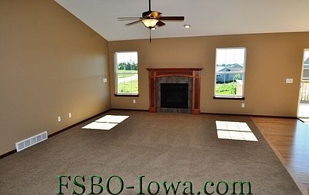 Vaulted Greatroom with custom bult Maple fireplace mantle.