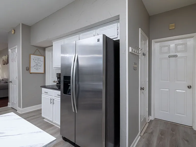 Bright, modern kitchen with a sleek island and cozy dining area.