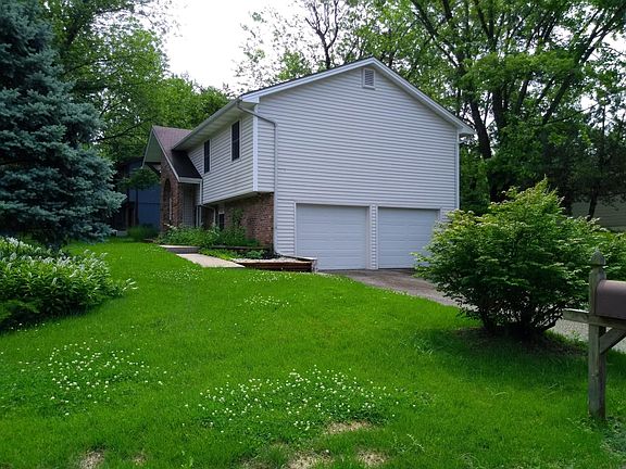 sits on large corner lot w/ mature trees