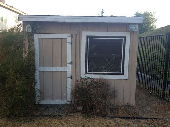 Children's play house in backyard