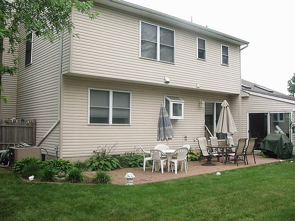 Fenced Rear Yard with Paver Patio and 3 Season Room with Hot Tub