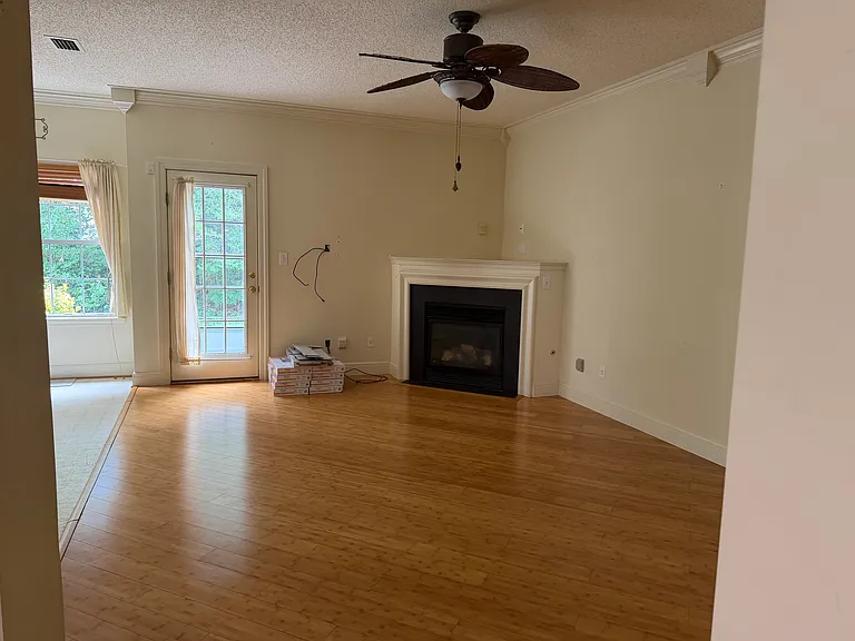 Family room with gas fireplace and patio doorway