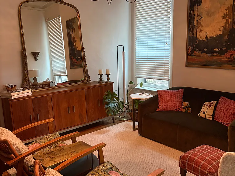 Middle room furnished as a lounge room but can be used as a dining room