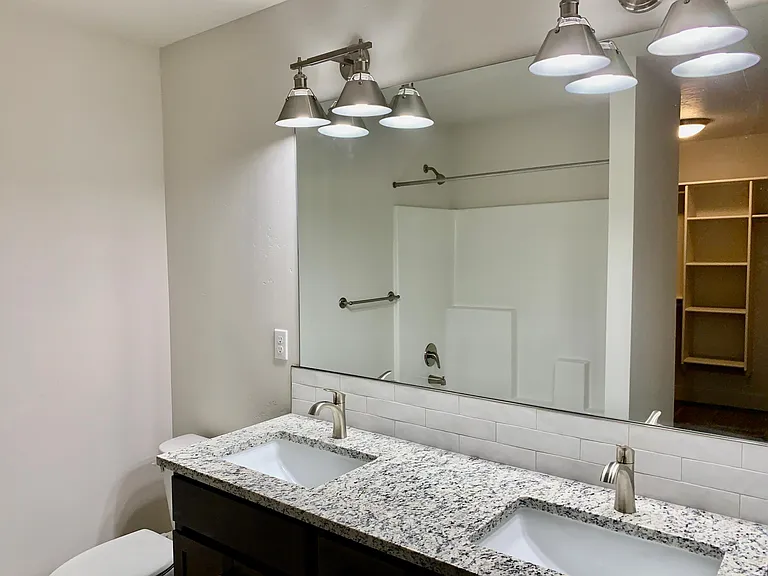 primary bath displaying entry into walk in closet