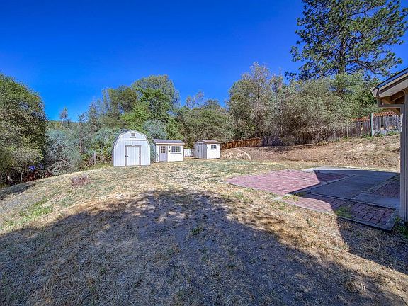 Backyard with storage sheds.