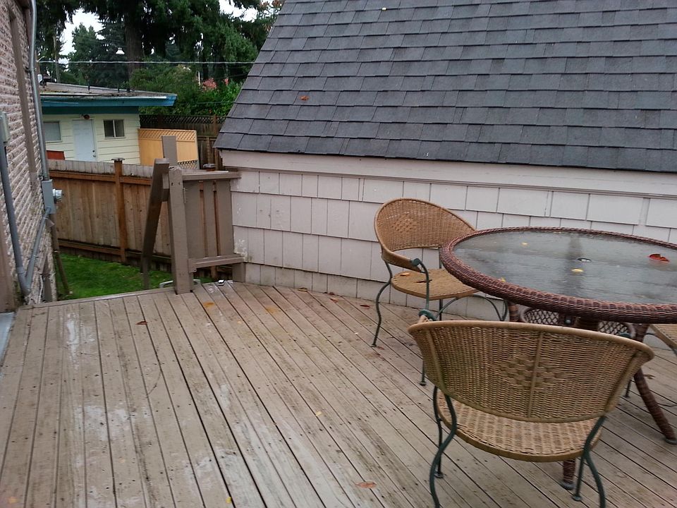 Dedicated outdoor space for upper unit is the side deck on south side of home.