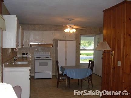 kitchen
						:
						Looking into kitchen from den