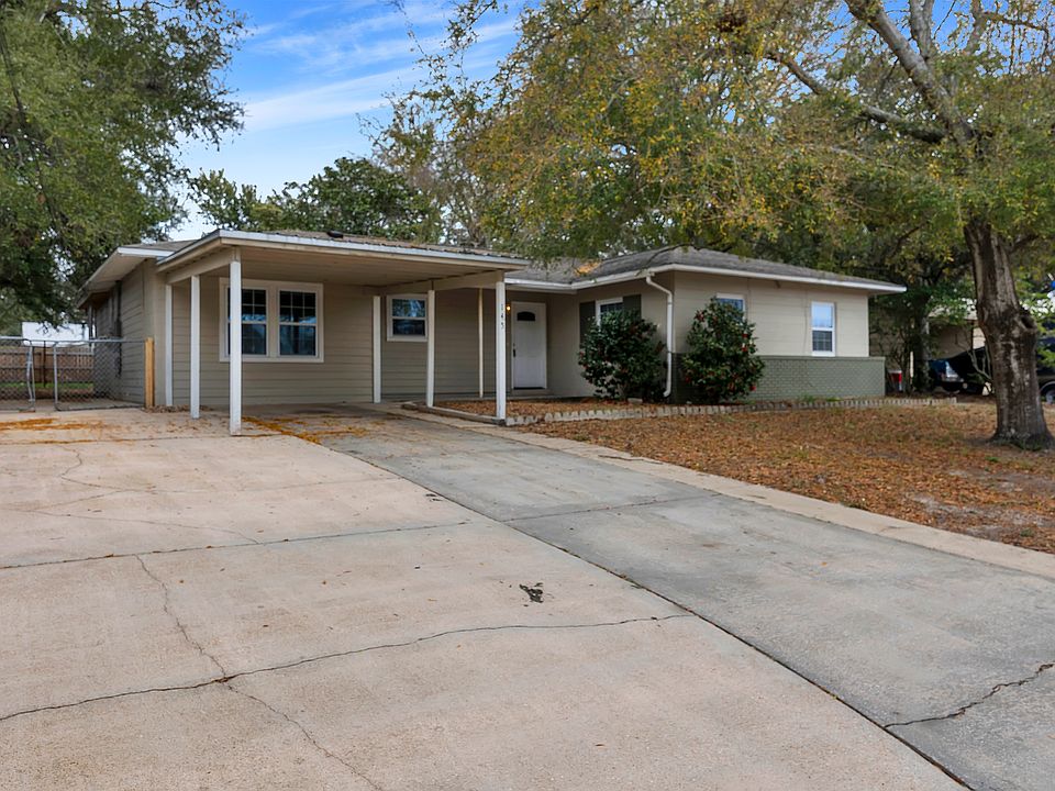 Front of house ; carport area