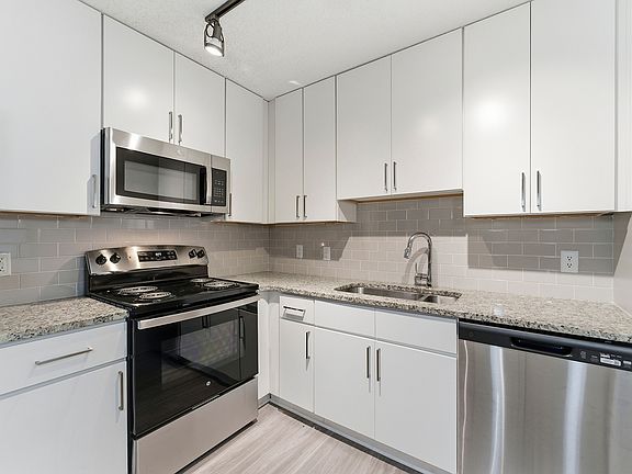 Bright and open living room with contemporary style at Buckhead & Vine Apartments