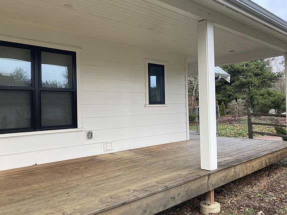 Deck runs on both south and east sides of house.