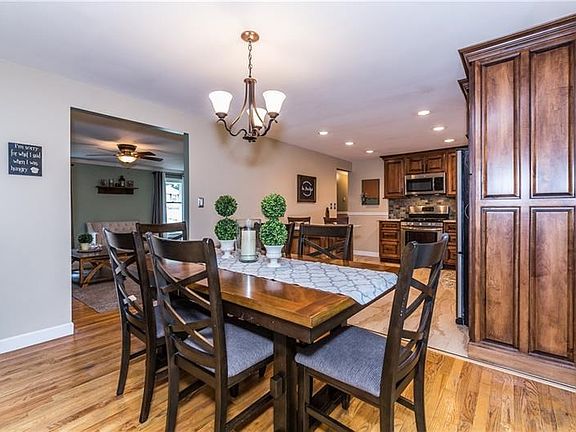 Recessed lighting accent the kitchen, and lots of natural light from the window above the sink and the sliding glass doors.