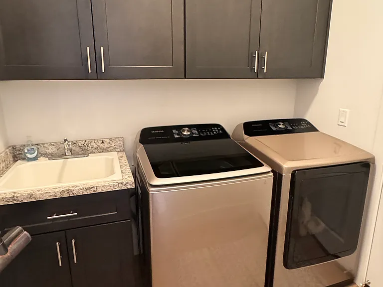 Full size washer and dryer on main floor. Upstairs casita also has full sized washer and dryer.
