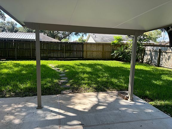 Huge back yard with covered patio for relaxing and entertainment