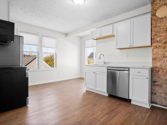 Cozy breakfast nook with beautiful sunlight and oversized windows.