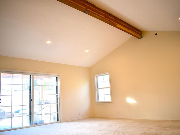 Master Bedroom is HUGE. King bed, sofa, TV, bar area, are all possible here! Vaulted ceiling with wood beam provides sophistication. Has walk in closet, master bathroom and ensuite luxury bathroom