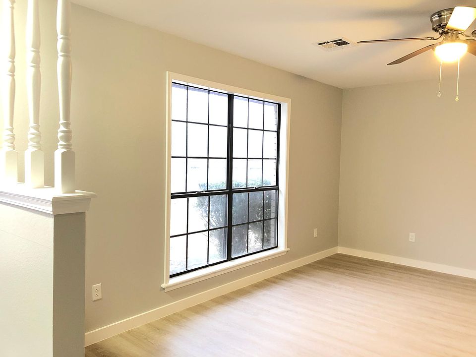 New light fixtures and ceiling fans, flooring and paint . Wonderful natural light with floor to ceiling windows in living area