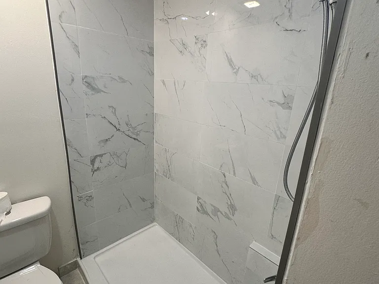 New porcelain-tiled shower