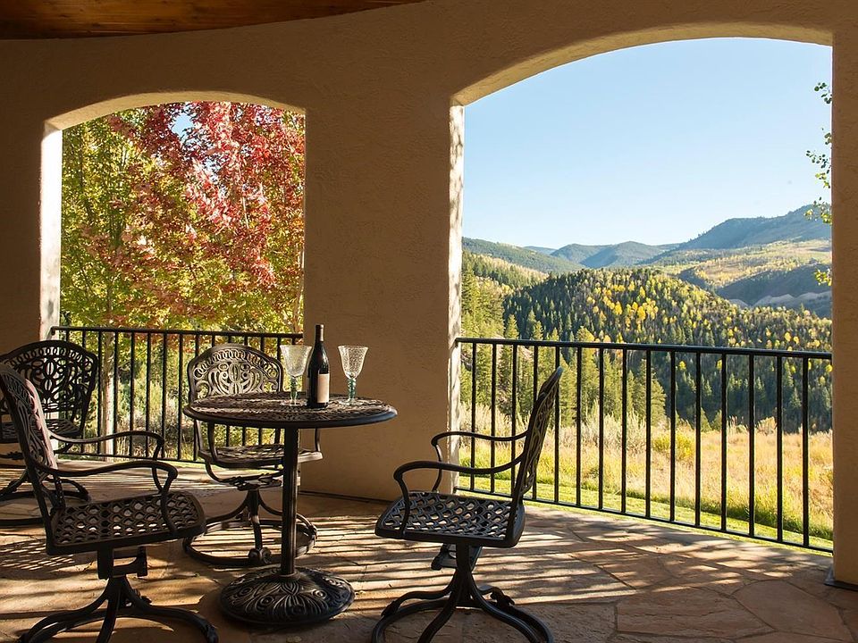 This wrap around covered deck can be accessed from the living room and also from a separate hallway. There is plenty of room to stretch out and enjoy the scenery or entertain family and friends. The mountain views from the covered deck are a perfect place