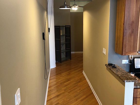 Hallway with new light fixtures and pulley system for two bikes