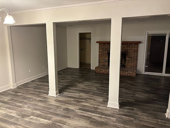 Living Room & Dining Room. 

Laundry Room in back - left of fireplace.