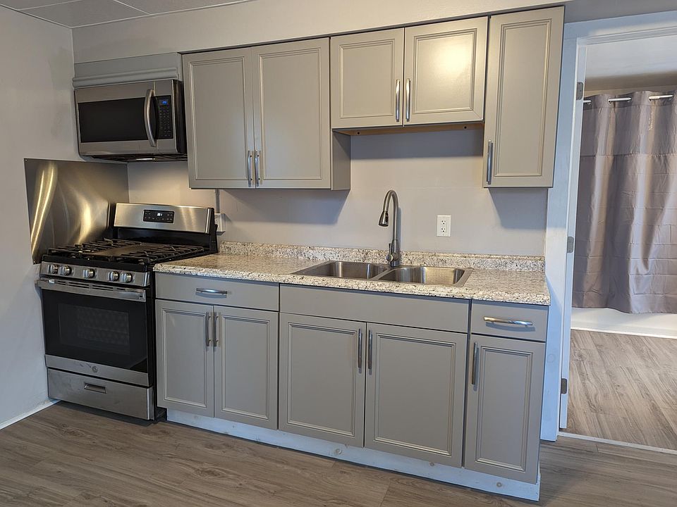 Kitchen with gas stove and microwave