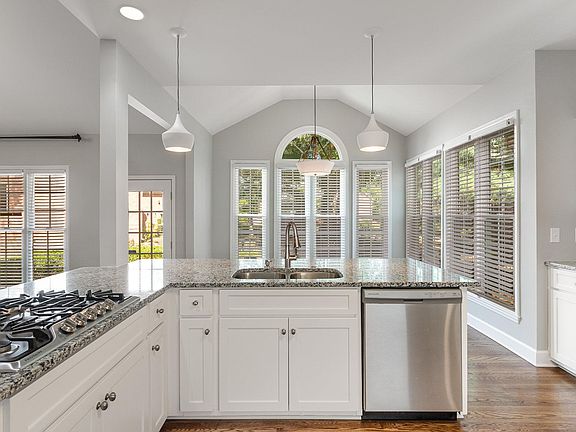 Enjoy meals from the kitchen that opens to a breakfast bar, dining nook, and 2 story great room.