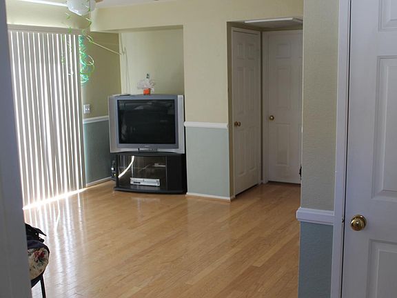 Downstairs family room with wood floors