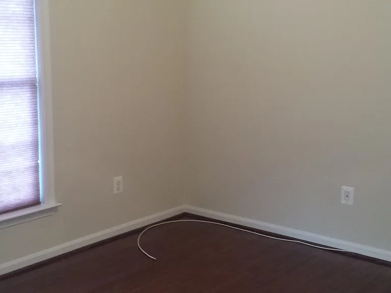 Another bedroom on 3rd level with ceiling fan and spacious closet