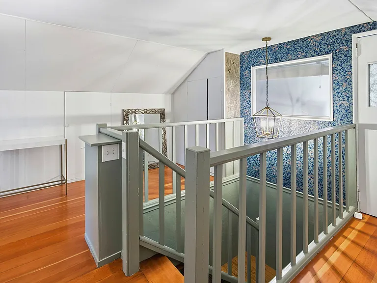 Top of the stairs on top floor.