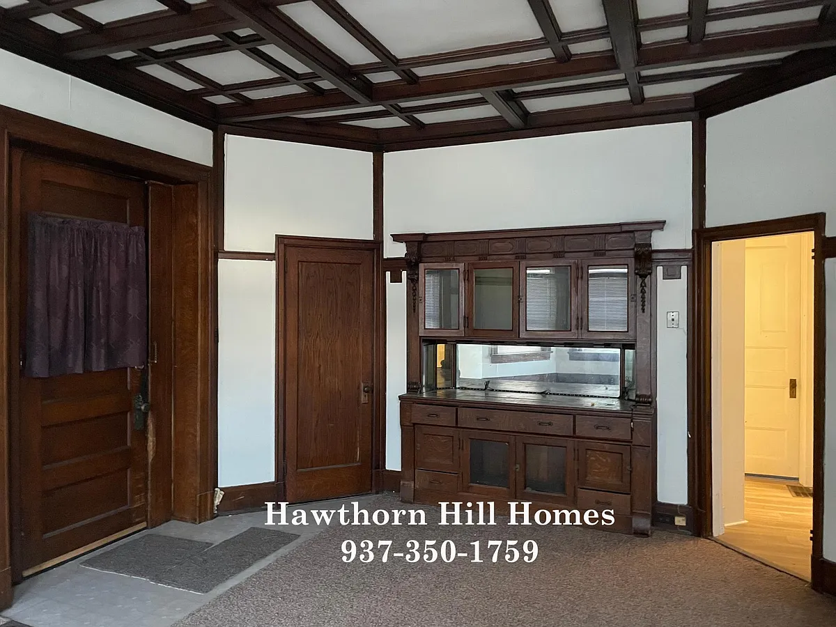 Front entrance and original built in cabinet in living room. - 1582 Wayne Ave #2