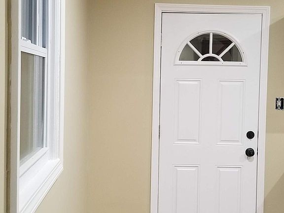 Kitchen door to balcony and exit outside.