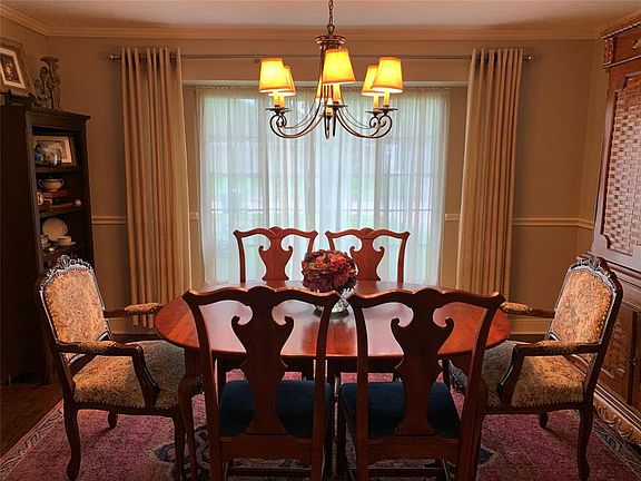 FORMAL DINING ROOM...The room is complete with CROWN MOLDING & CHAIR RAILING