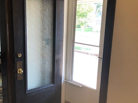 W/glass paned entry door open