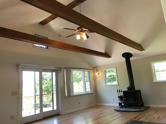 Living Room with cathedral ceilings & woodstove