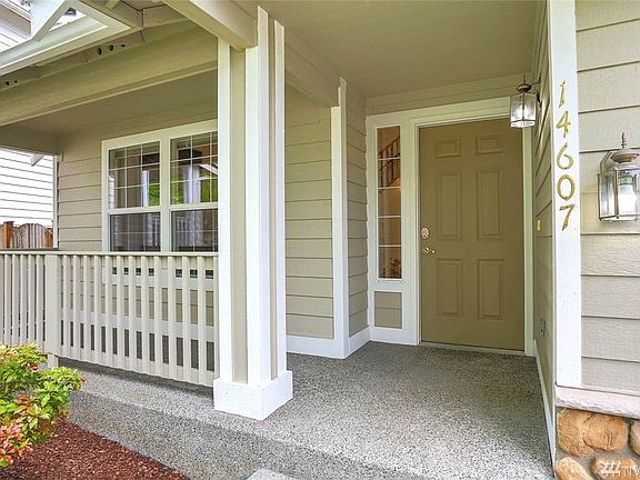 This deep covered porch provides a gracious entry.  Delight in the wonderful location of this home, just steps from Lake Youngs watershed trail and close to major freeways, hospital, SeaTac Airport, major retail, dining & business hubs.