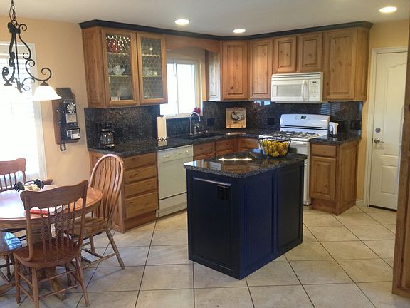 granite counters and tile in kitchen