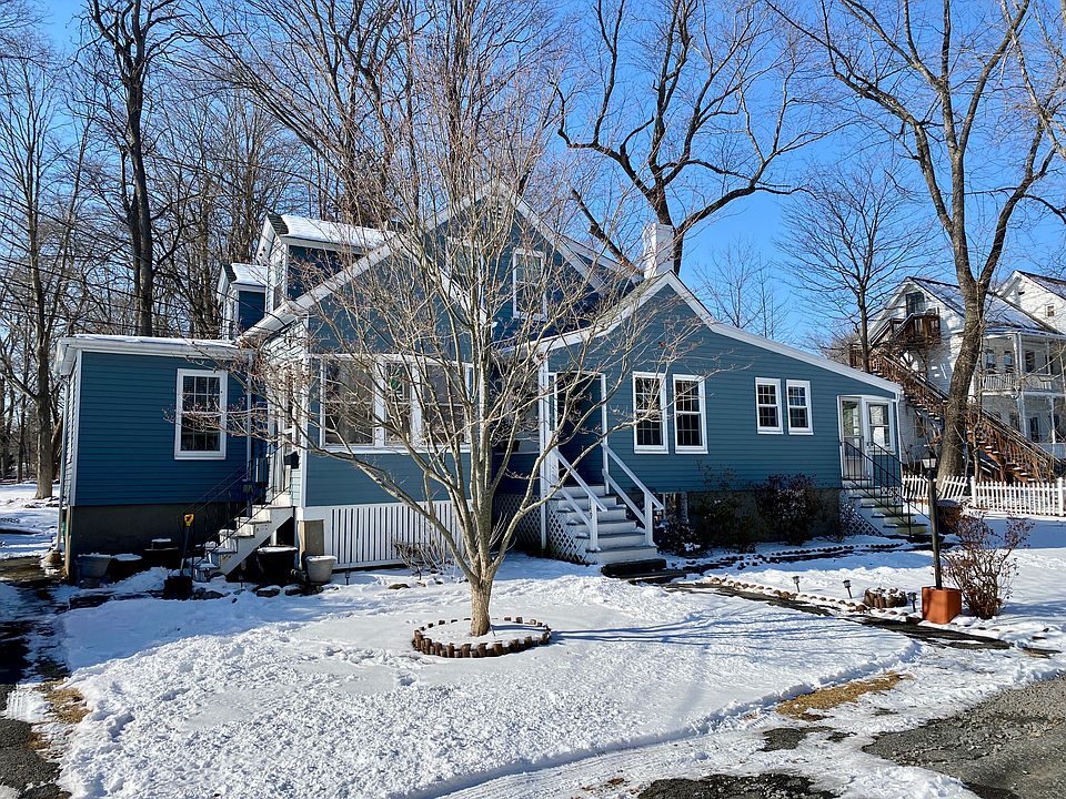 Exterior front - unit is the middle staircase which is the main entryway to the right staircase which is the rear porch entryway.