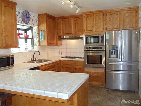 Open Kitchen With Stainless Steel Appliances