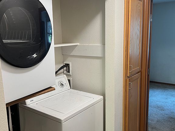 laundry between main floor bedroom and linen closet