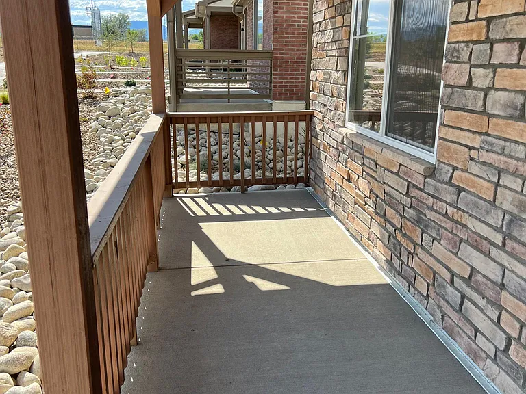 Large front porch facing open space