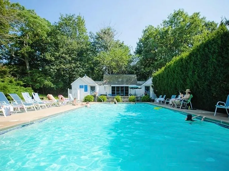 The community swimming pool and pool house