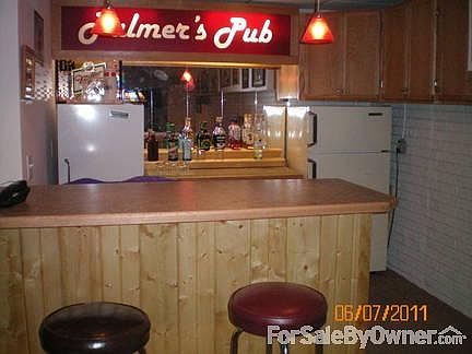 part of the rec room
						:
						dry bar with oak cabinetry in the basement... huge 32 by 40 rec/family area.