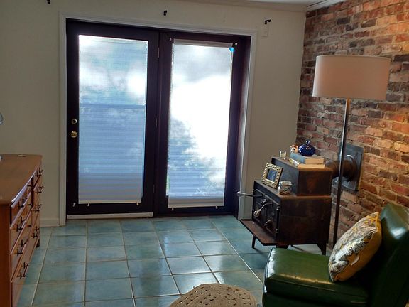 Door exiting the master bedroom to rear yard.