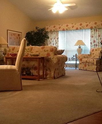 Spacious family room with cathedral ceiling.