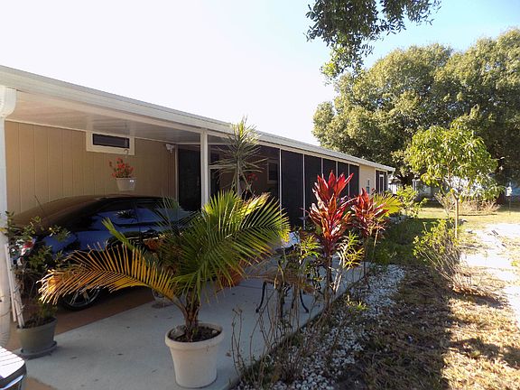 CARPORT SIDE OF HOME