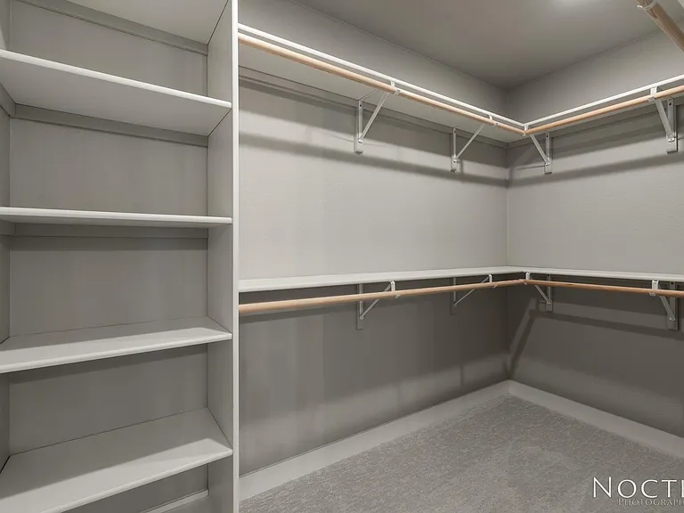 Master bedroom with ensuite bath and grand closet. (Photo of another unit with similar finishes and quality.)