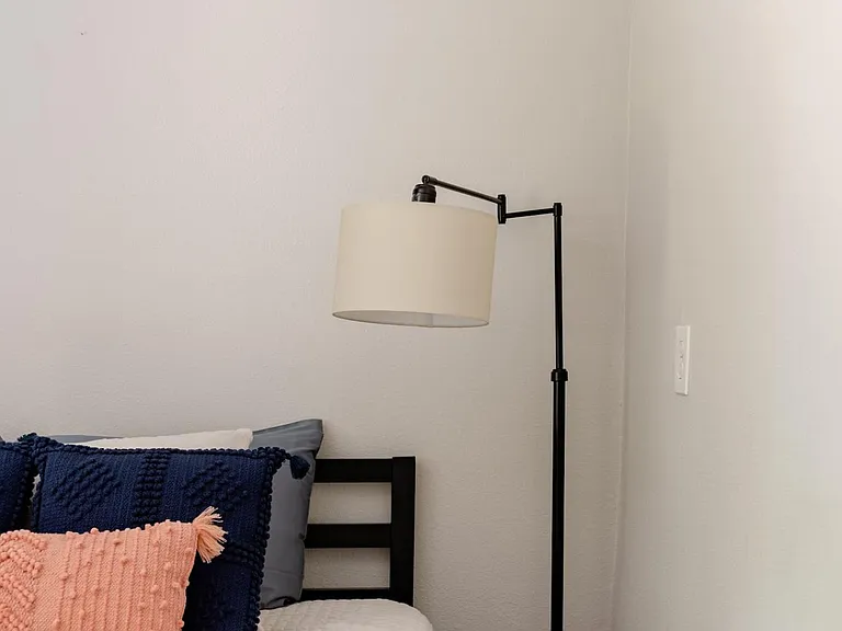It has it's own closet, and there are a few stairs down to reach this room.