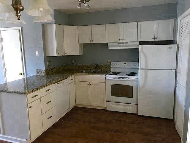 Kitchen - granite countertops and new shaker-style cabinets