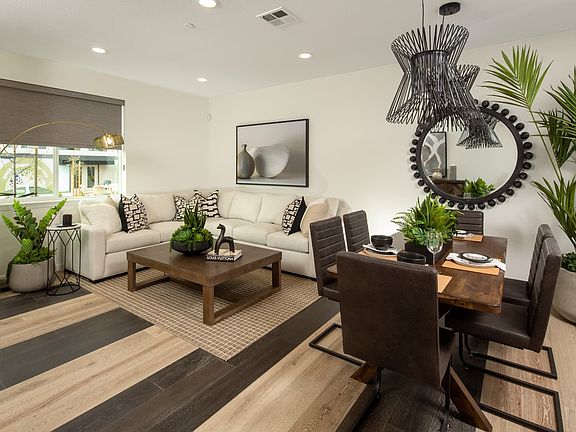 With an open layout, it seamlessly connects to the kitchen and dining area. It creates an atmosphere