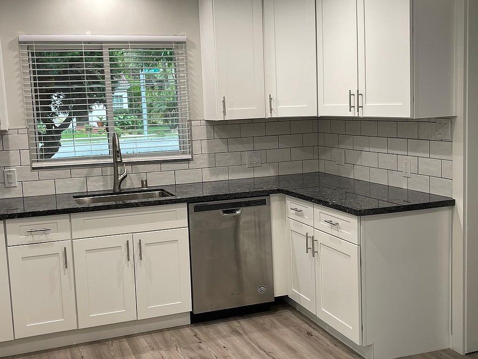 Newly remodeled kitchen with gas stove and dishwasher.